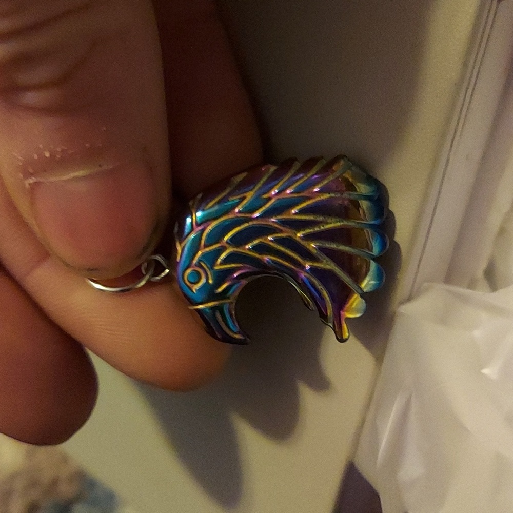 Unusual crystal carving. Rainbow hematite eagle
